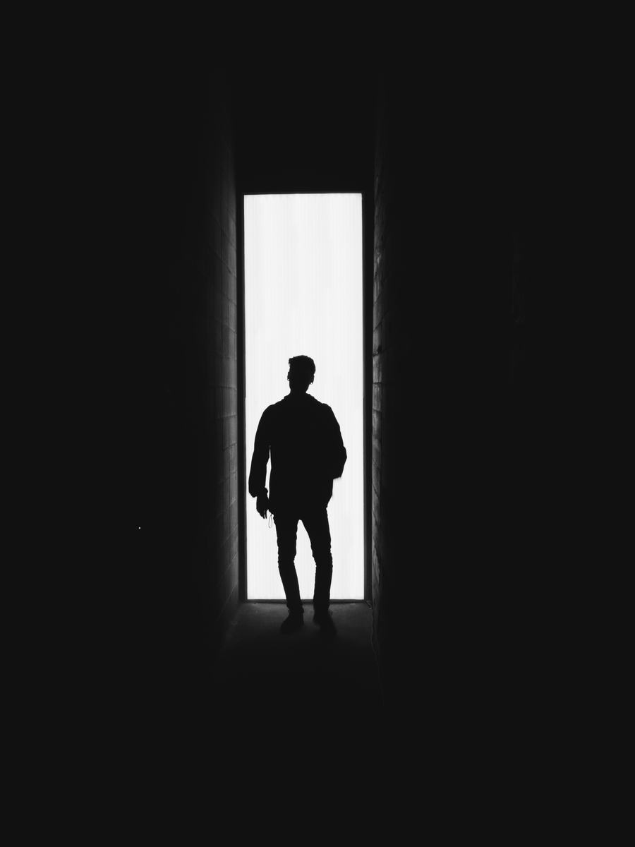 A figure standing in the light