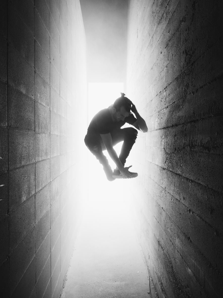 A visitor caught mid-jump in the light